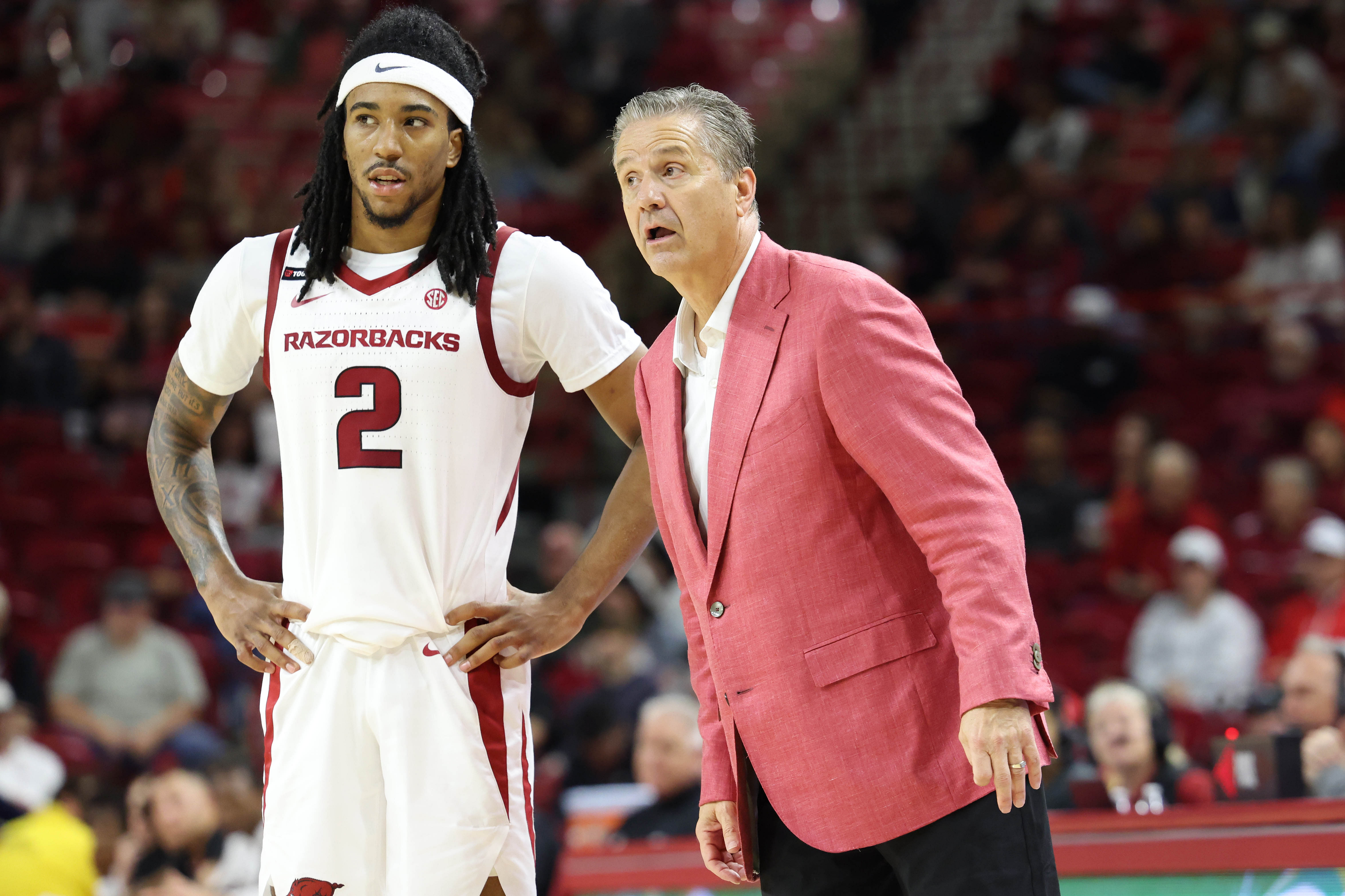 Arkansas Razorbacks head coach John Calipari listens to guard Boogie Fland (#2) during the second half of their NCAA game against the Pacific Tigers at Bud Walton Arena. Photo: Imagn